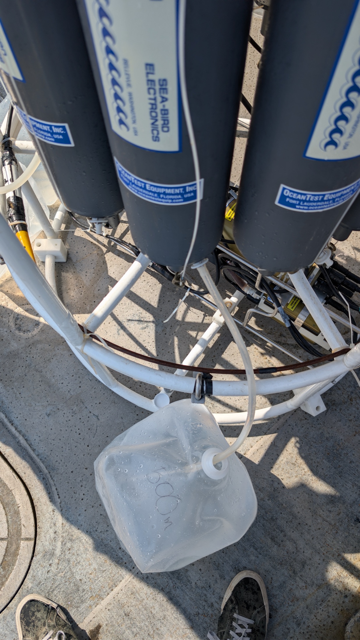 A water sample being collected from a CTD rosette