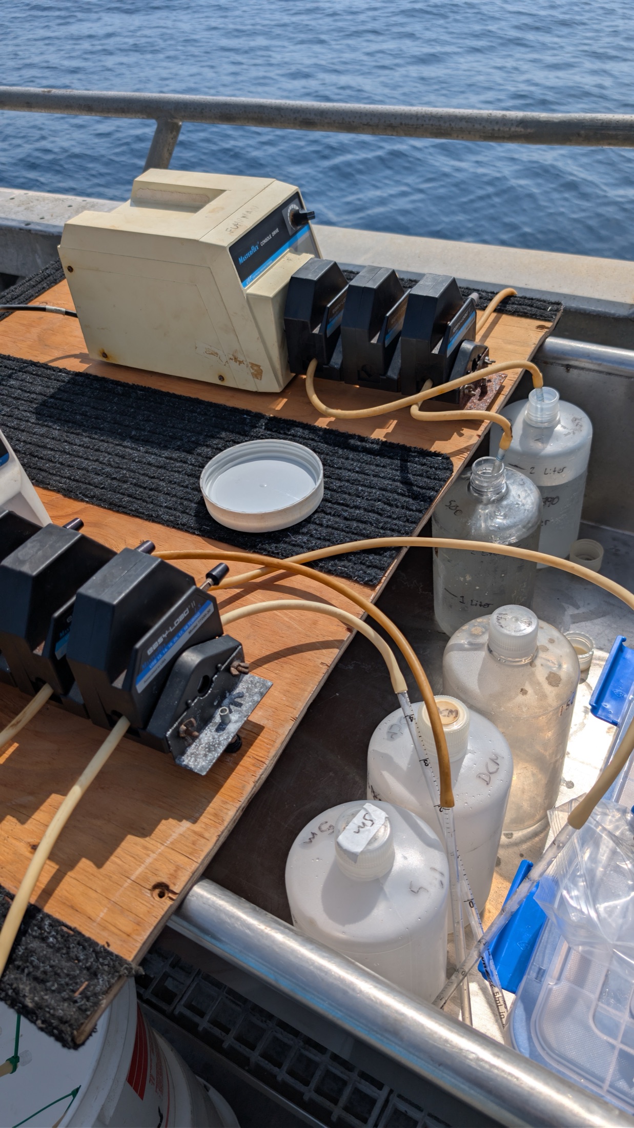 Peristaltic pumps, sample bottles, and filtration tubing on deck