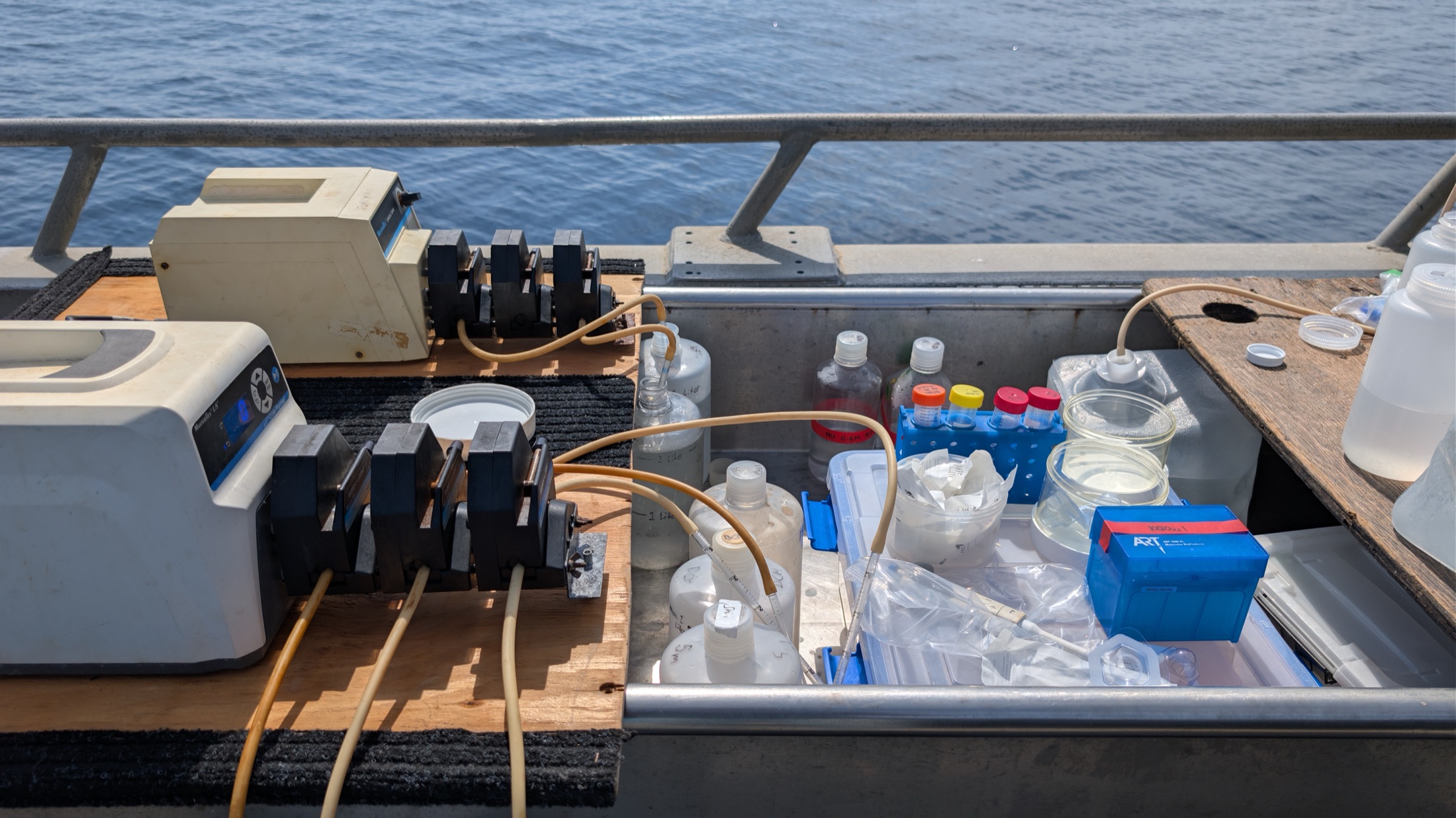 A seawater filtration station with peristaltic pumps and sample bottles